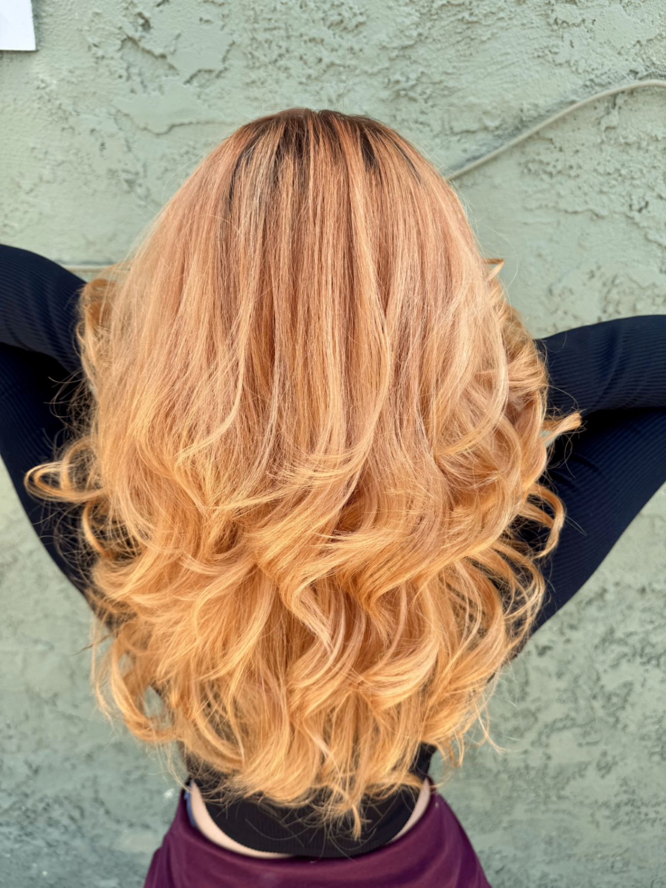 Warm strawberry blonde color with bouncy curls