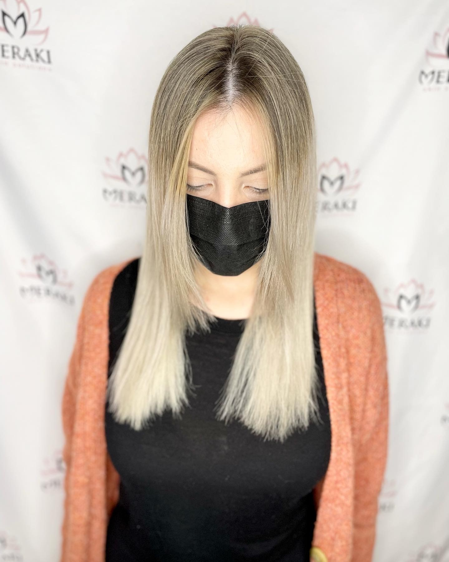 Sleek blonde balayage with smooth straight finish